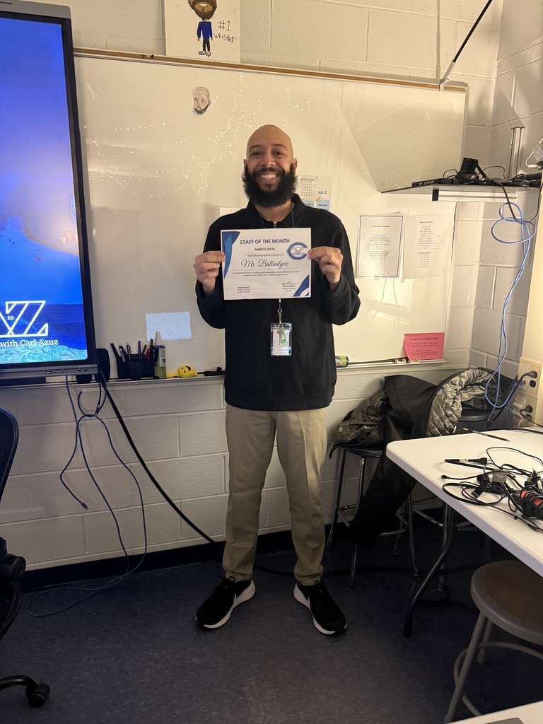 Mr. Ballantyne holding an award