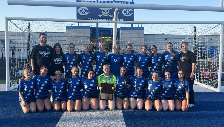 cHS girls varsity soccer team with the downriver league champs plaque
