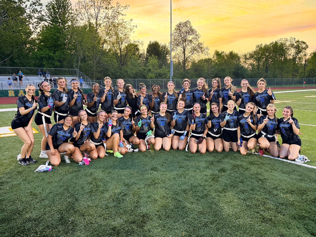 Flag football team posed together on a field