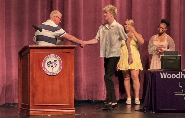 DCTC students on stage winning awards 