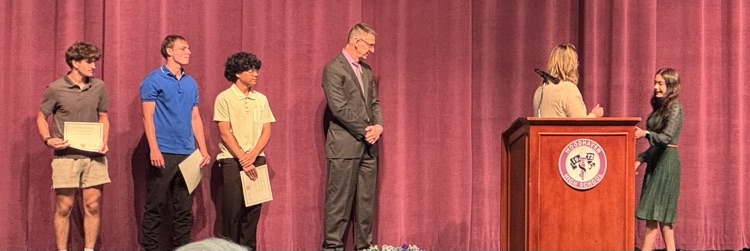 DCTC students on stage winning awards 