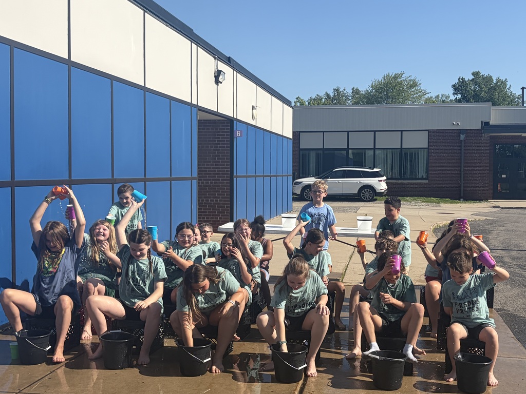Students at field day playing water game.
