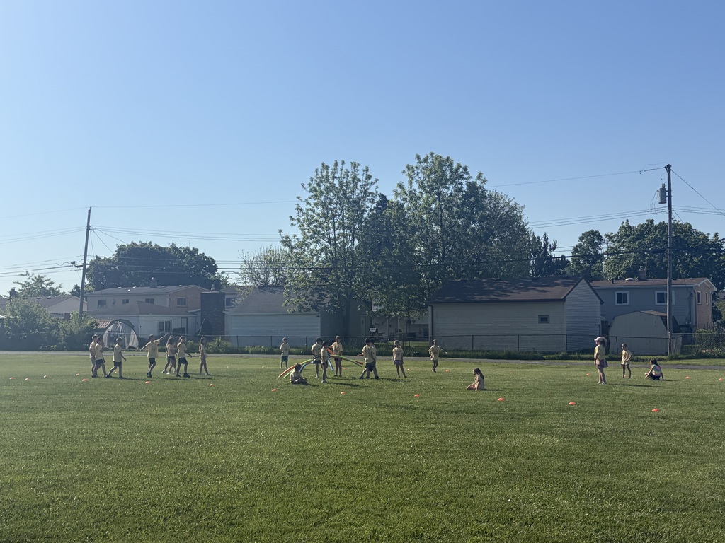 Children playing tag at field day