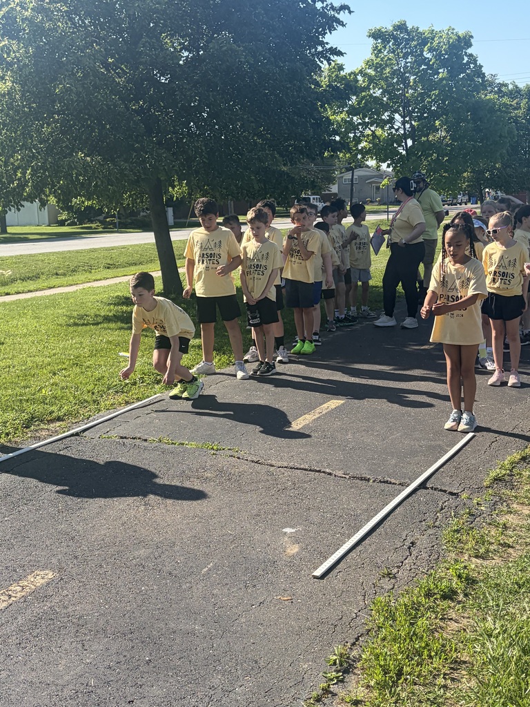 Boy doing the long jump at field day