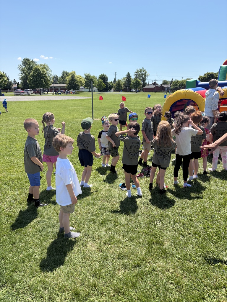 Students waiting for a bounce house.