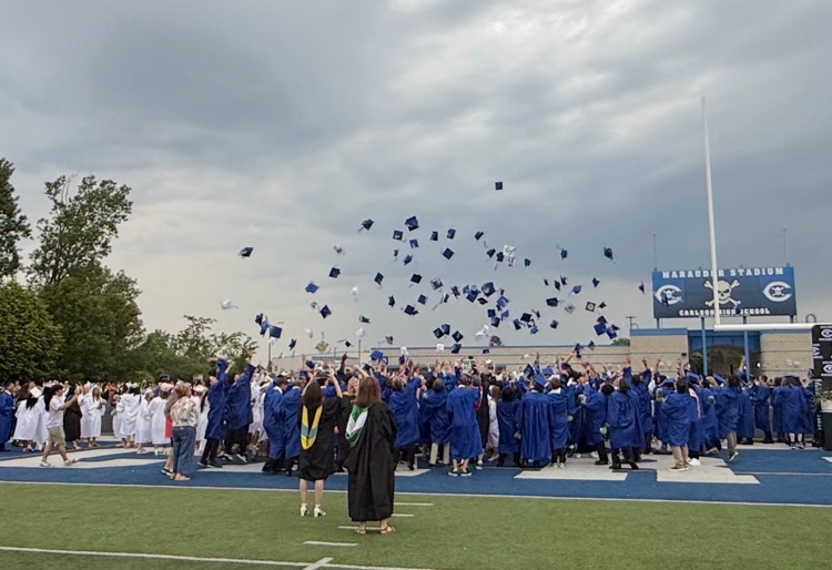 seniors throwing their caps 
