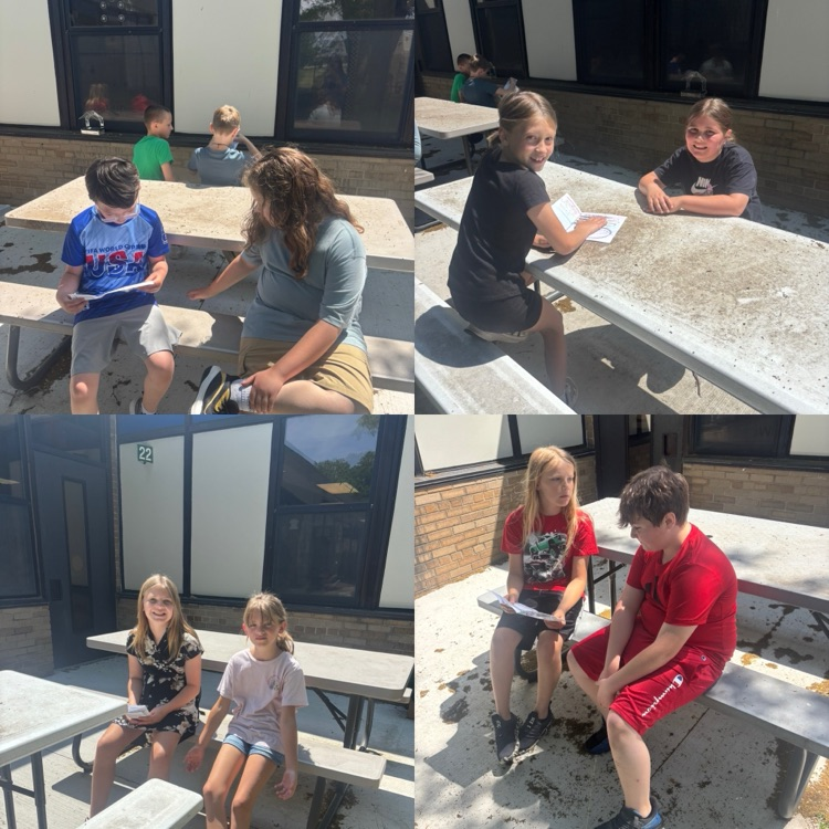 Image of fourth grade students meeting with third grade students