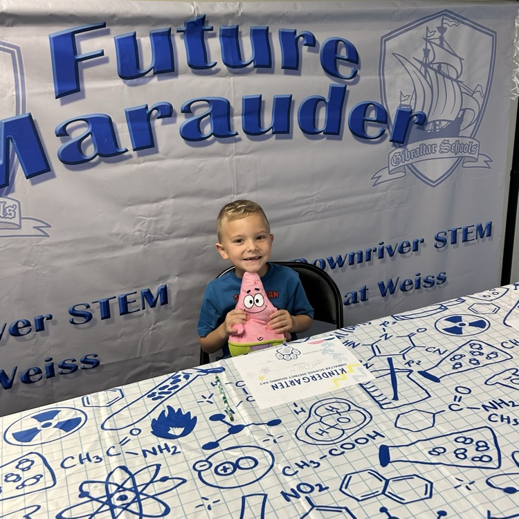 student signing kindergarten letter