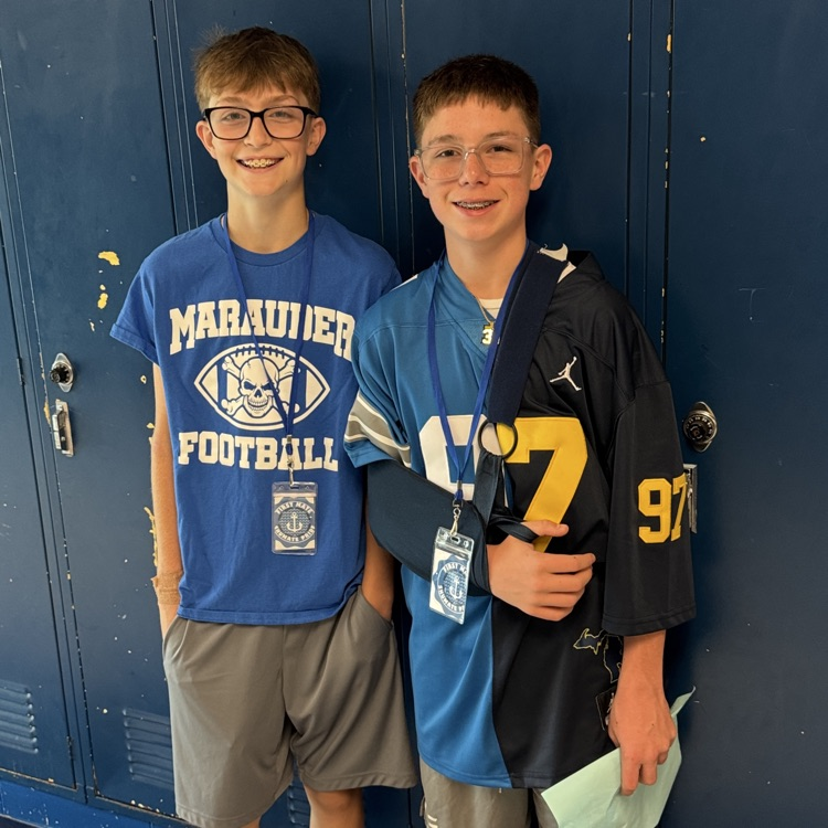two students standing for picture