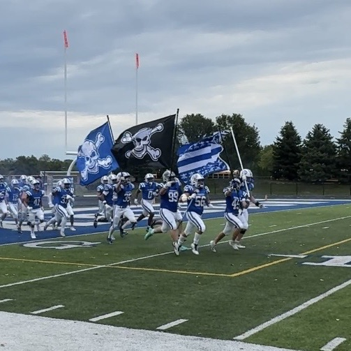 football team running out on the field