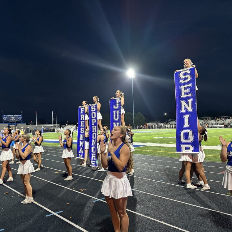 cheerleaders performing a cheer