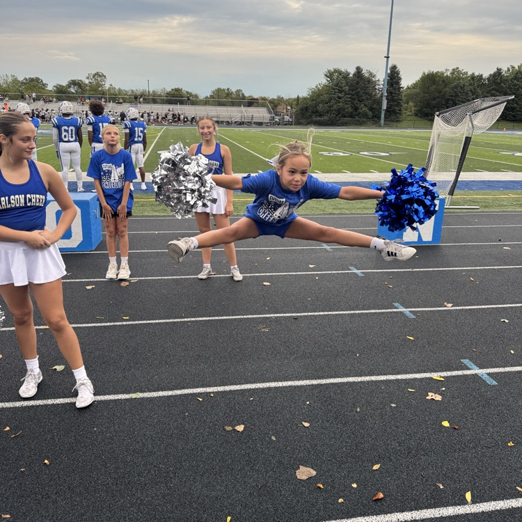 cheer camp participant doing a jump