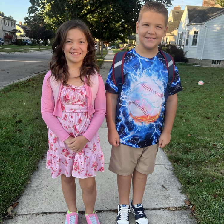 two students getting ready for school