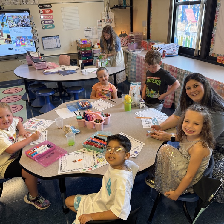 principal and students working on a project