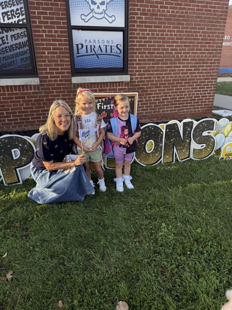 Principal with two new kindergarten students