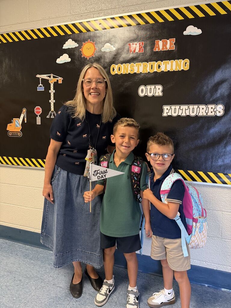 Principal with students on the first day of school