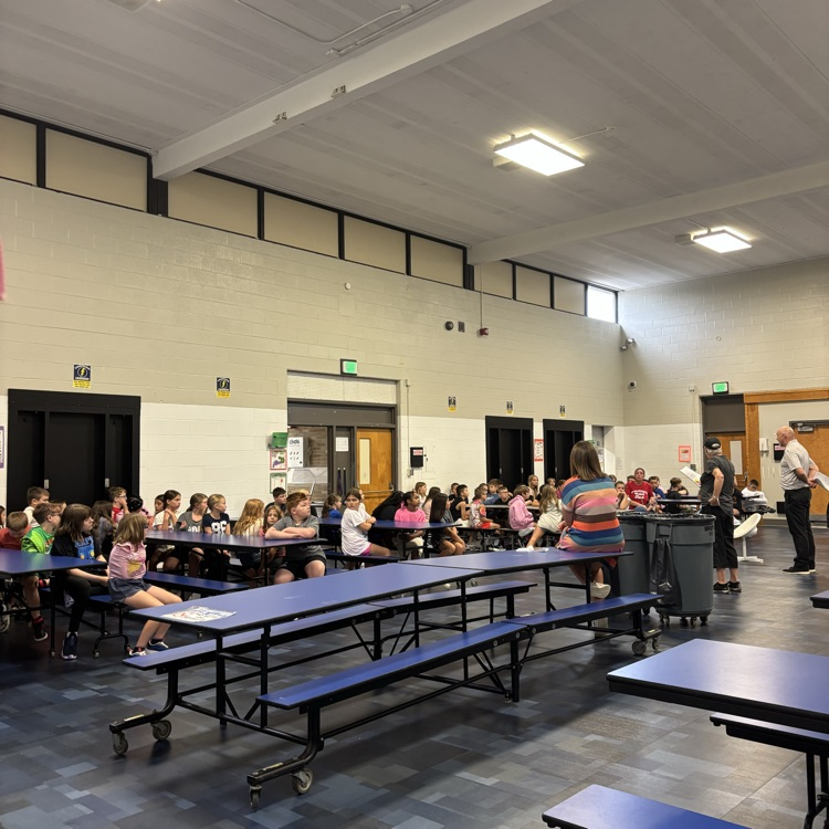 Students participate in PBIS rotations throughout the school, listening and looking attentively as teachers review school-wide expectations and rules.