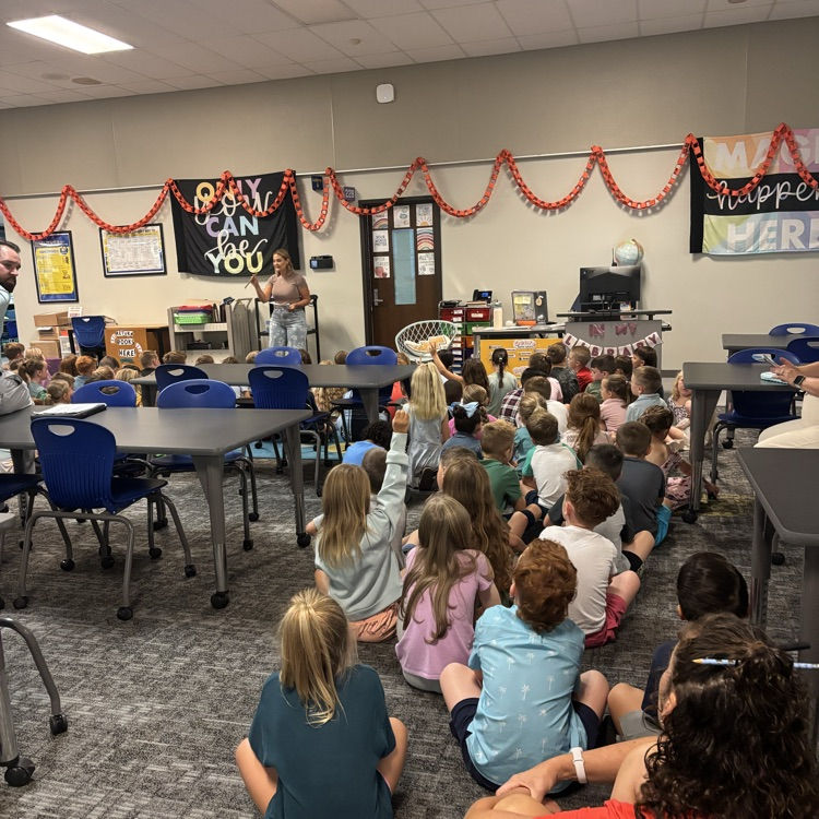 Students participate in PBIS rotations throughout the school, listening and looking attentively as teachers review school-wide expectations and rules.