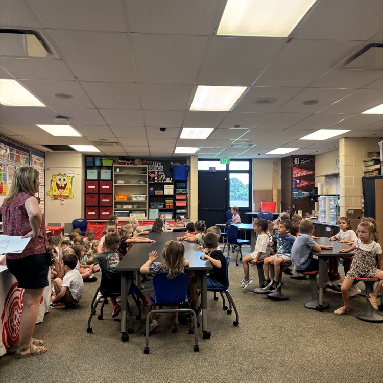 Students participate in PBIS rotations throughout the school, listening and looking attentively as teachers review school-wide expectations and rules.