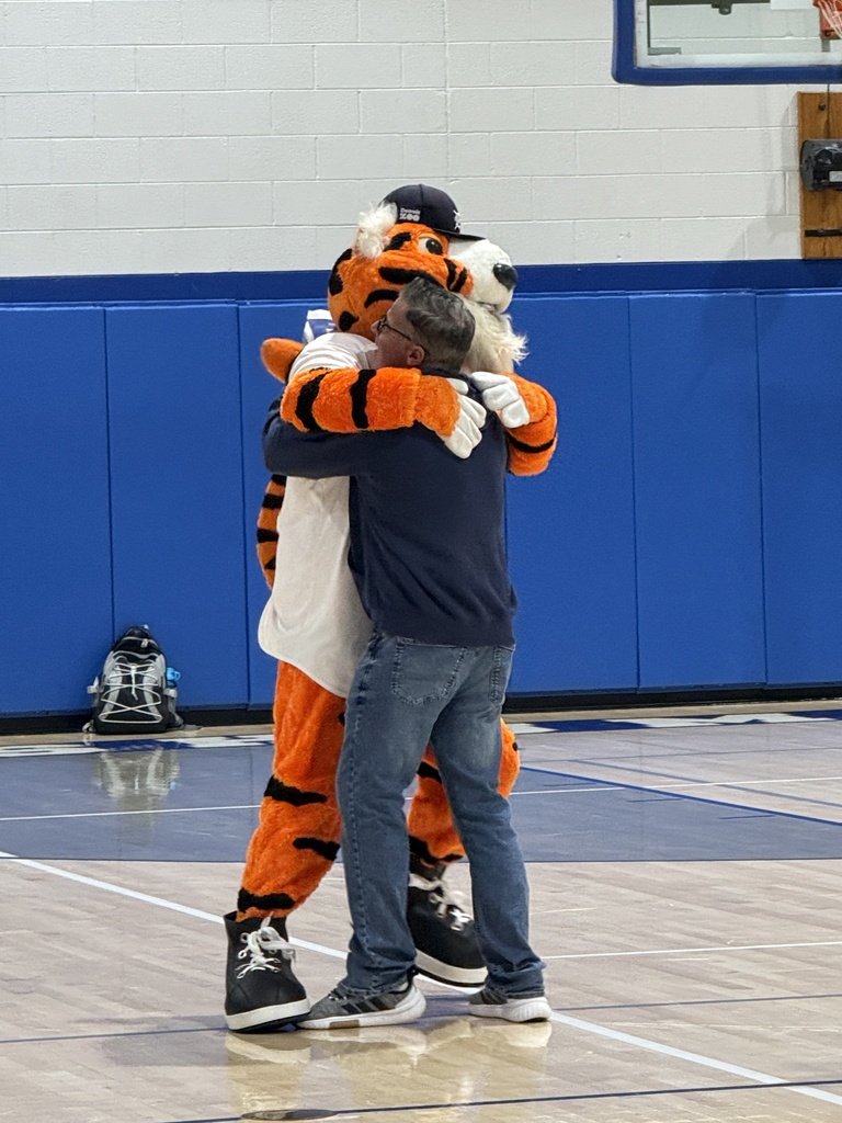 Paws embraces Mr. Cassie