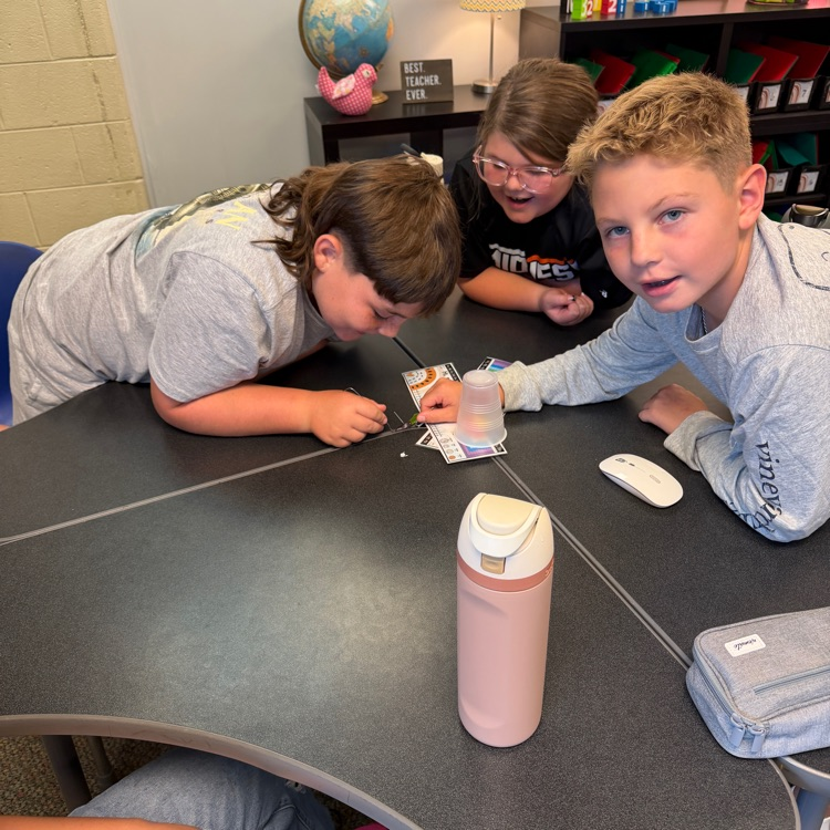Students work together during a “Saving Fred” activity, using teamwork, communication, and problem-solving skills to rescue Fred without using their hands.
