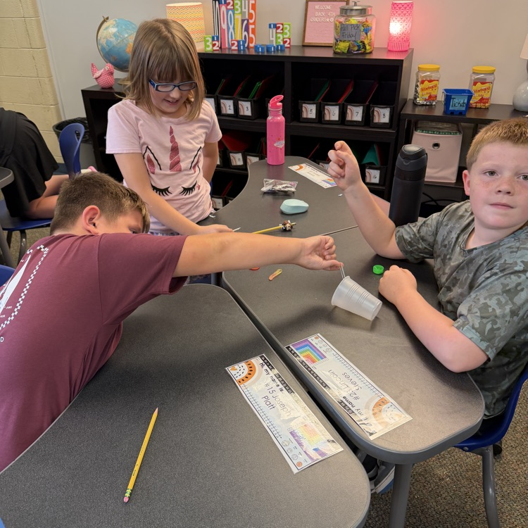 Students work together during a “Saving Fred” activity, using teamwork, communication, and problem-solving skills to rescue Fred without using their hands.