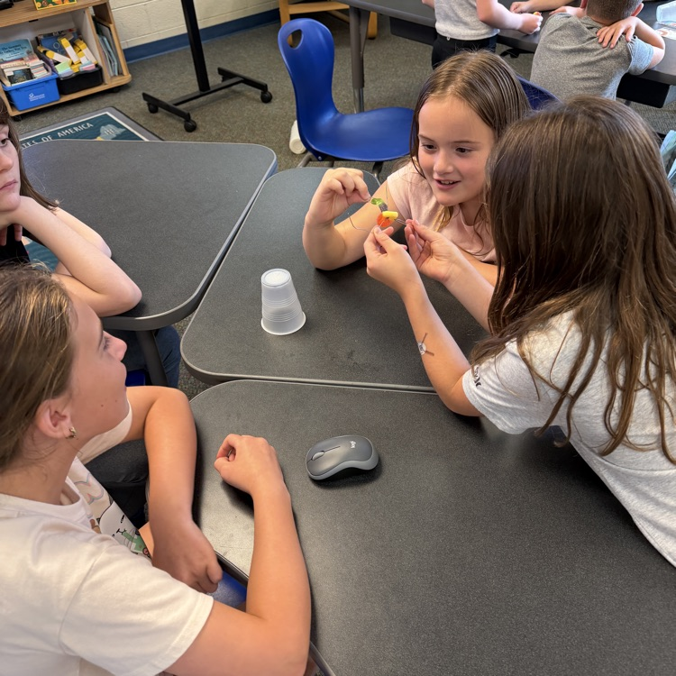 Students work together during a “Saving Fred” activity, using teamwork, communication, and problem-solving skills to rescue Fred without using their hands.