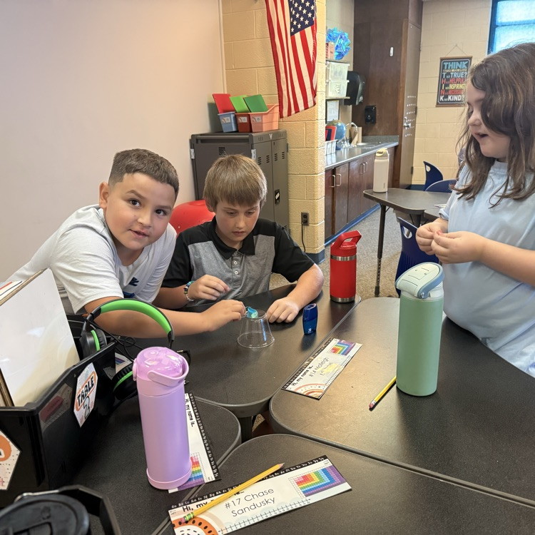 Students work together during a “Saving Fred” activity, using teamwork, communication, and problem-solving skills to rescue Fred without using their hands.