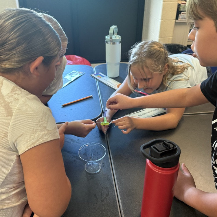 Students work together during a “Saving Fred” activity, using teamwork, communication, and problem-solving skills to rescue Fred without using their hands.