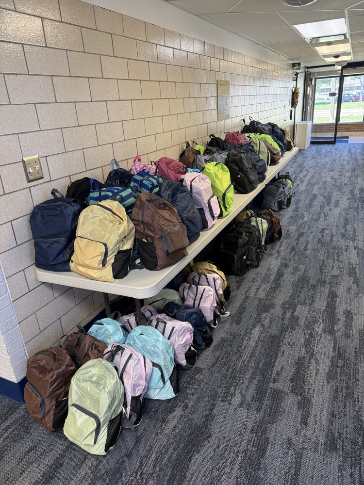 backpacks, getting ready to be donated to the schools