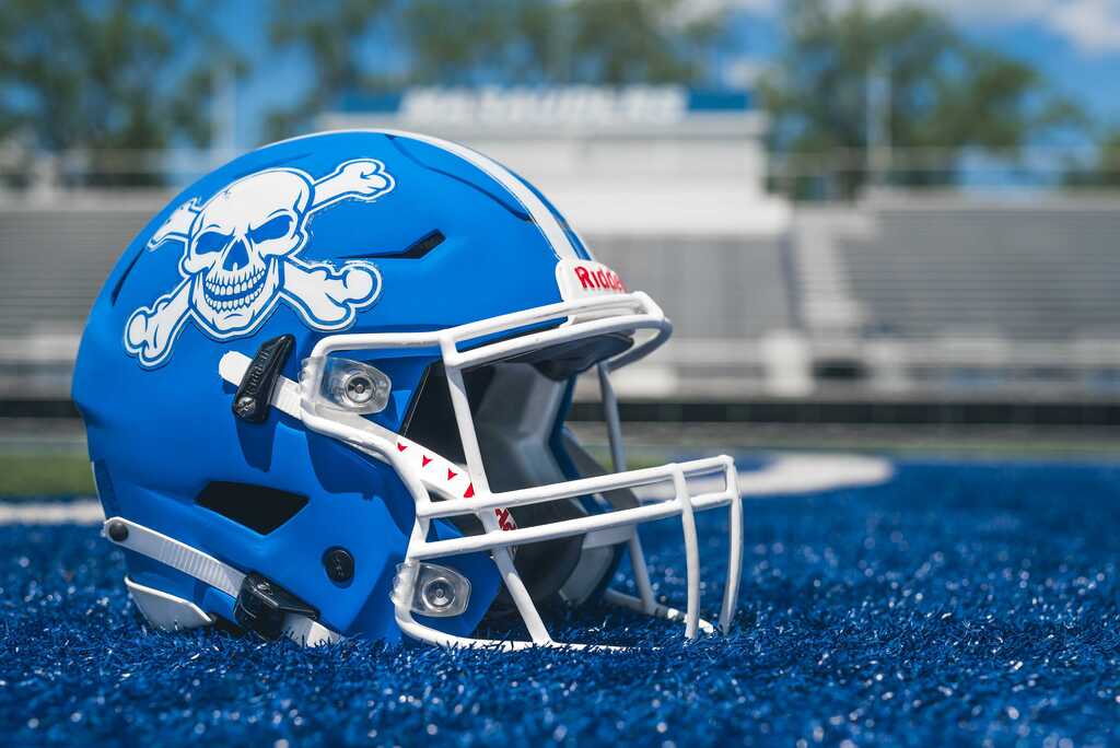 Marauder football helmet on turf