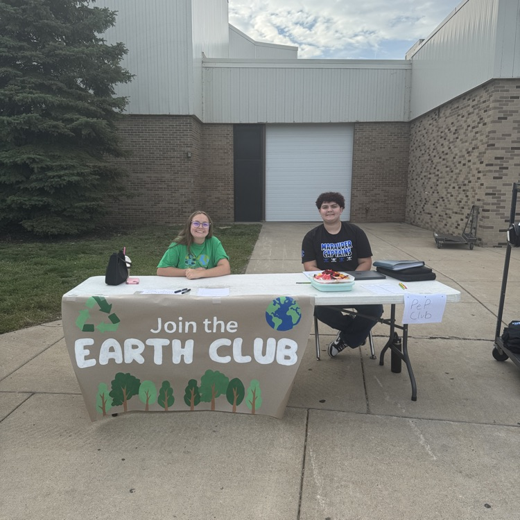 students promoting their Earth Club