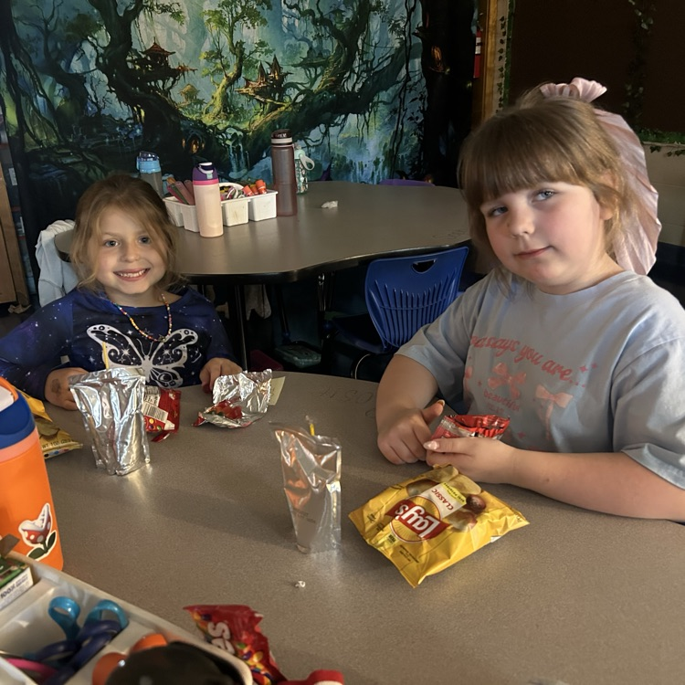 Students sit in their classroom enjoying snacks while watching a movie during Chapman’s PBIS Movie Theater.