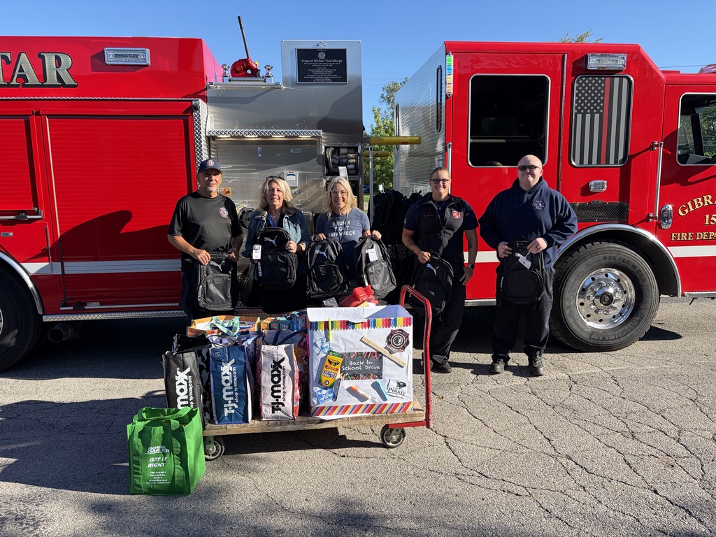 Teachers with Fire Department and School Supplies