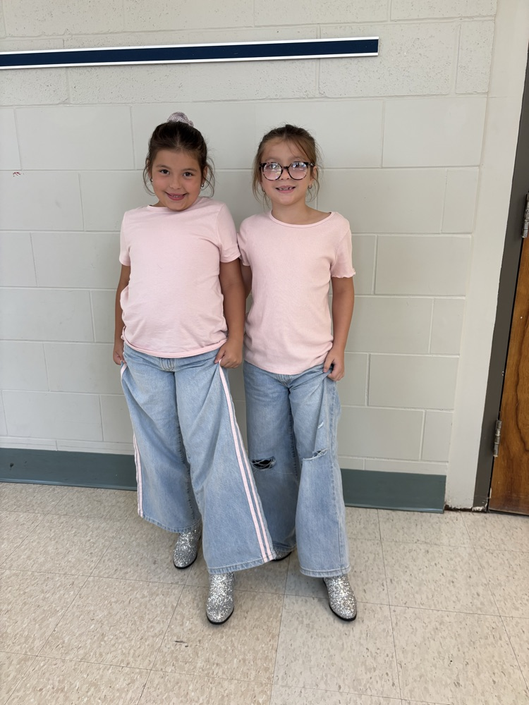 Students and teachers throughout Chapman Elementary smile for photos while wearing pink for Dolly Parton Day on September 25.