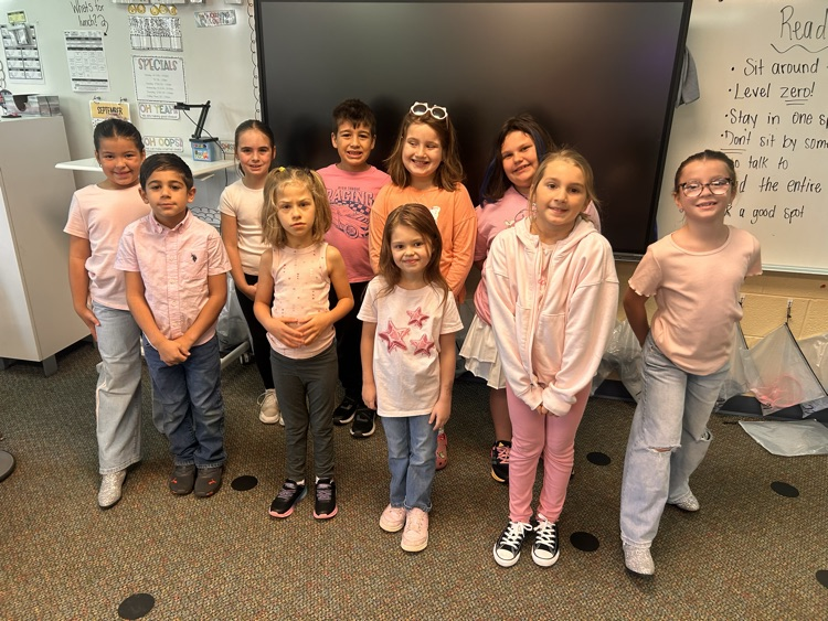 Students and teachers throughout Chapman Elementary smile for photos while wearing pink for Dolly Parton Day on September 25.