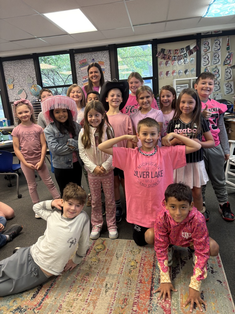 Students and teachers throughout Chapman Elementary smile for photos while wearing pink for Dolly Parton Day on September 25.