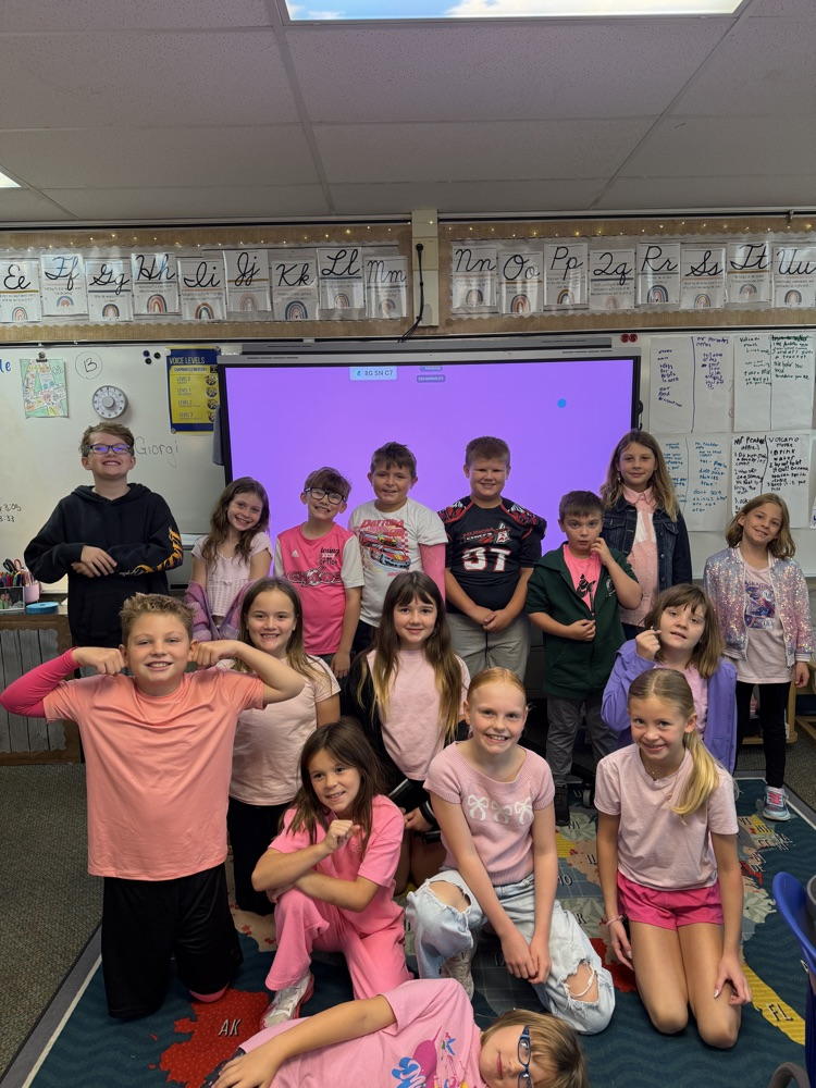 Students and teachers throughout Chapman Elementary smile for photos while wearing pink for Dolly Parton Day on September 25.