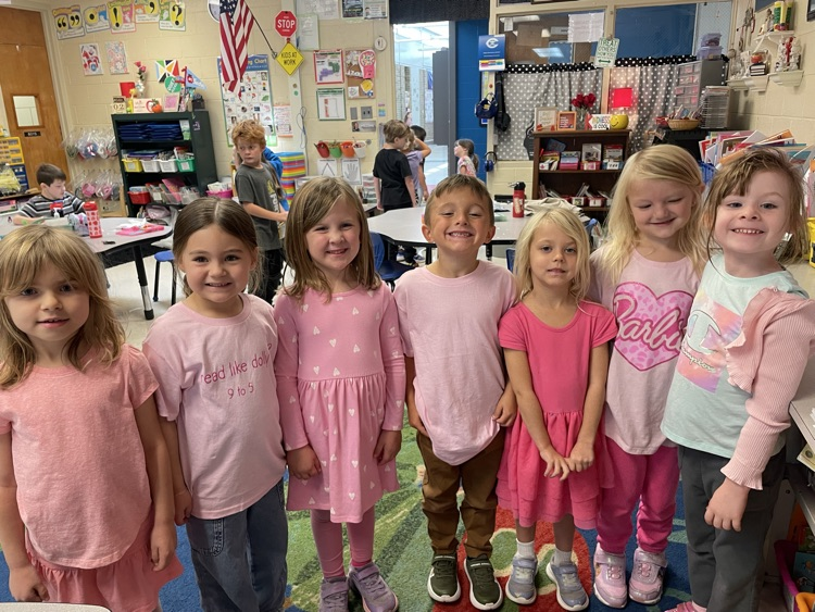 Students and teachers throughout Chapman Elementary smile for photos while wearing pink for Dolly Parton Day on September 25.