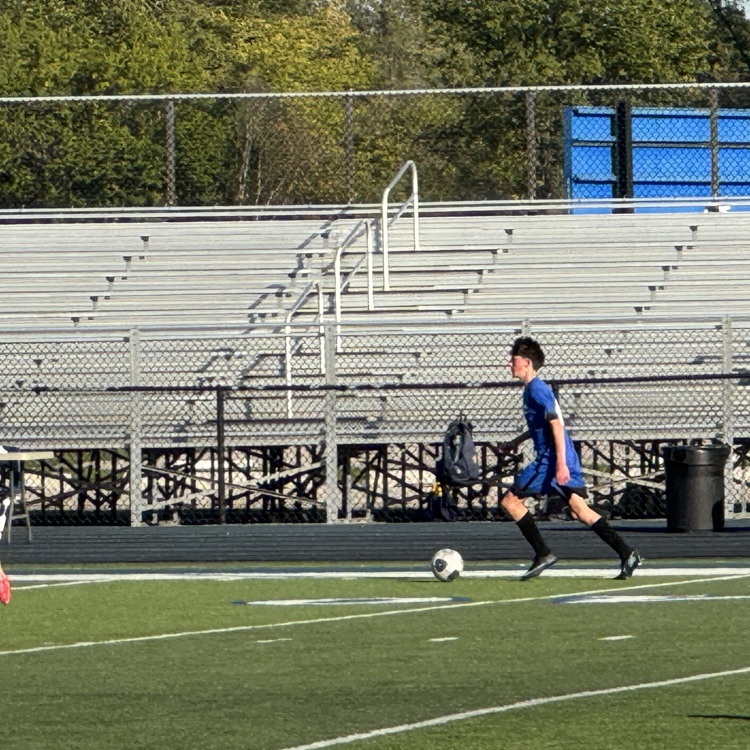 soccer dribbling down the field