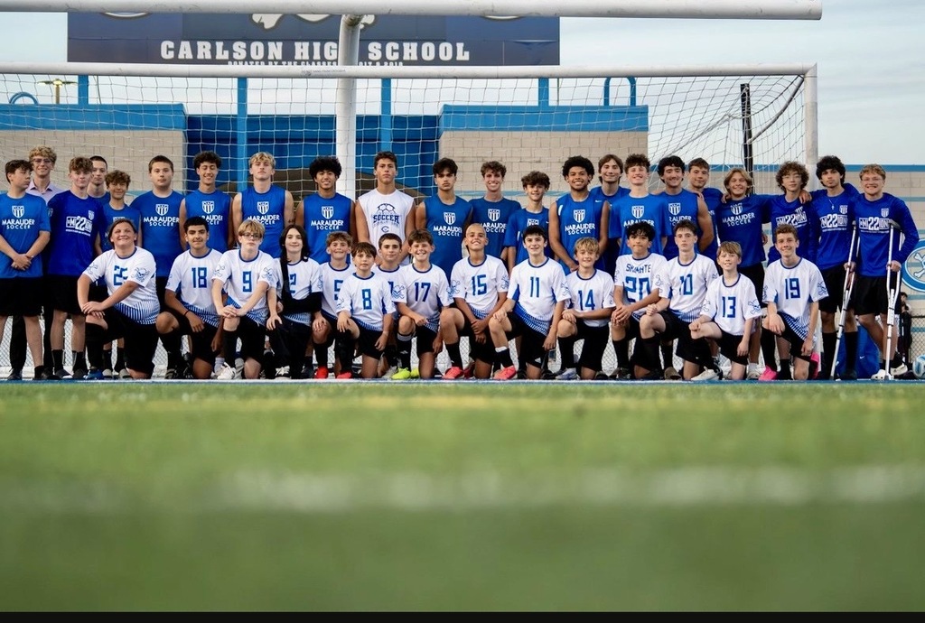 A group photo of the middle school and high school soccer teams at Shumate Middle School and Carlson High School