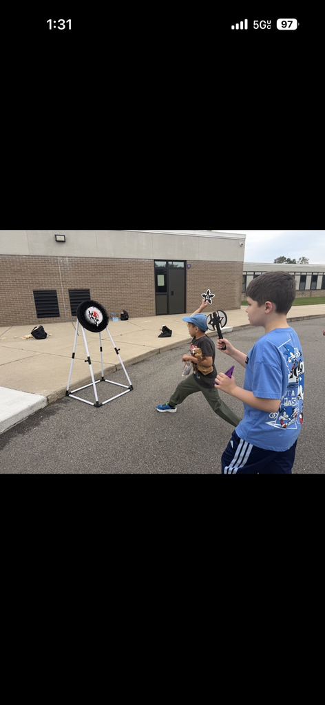 Students enjoying the September PBIS Party by playing outdoor yard games with their classmates.