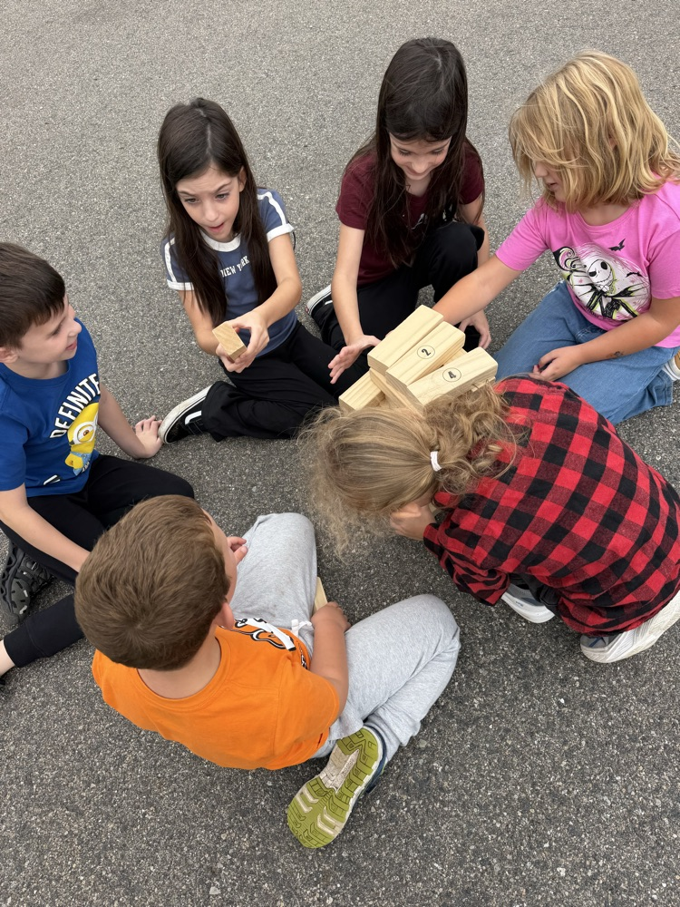 Students enjoying the September PBIS Party by playing outdoor yard games with their classmates.