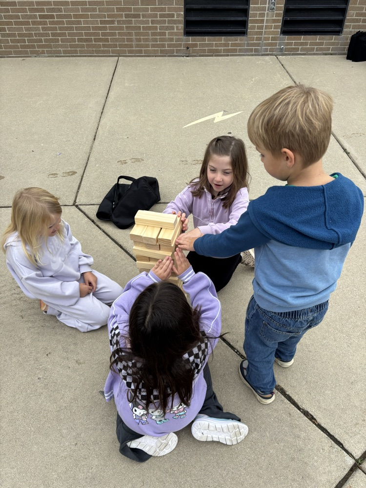 Students enjoying the September PBIS Party by playing outdoor yard games with their classmates.
