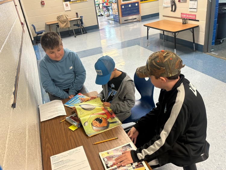 older and younger students reading together
