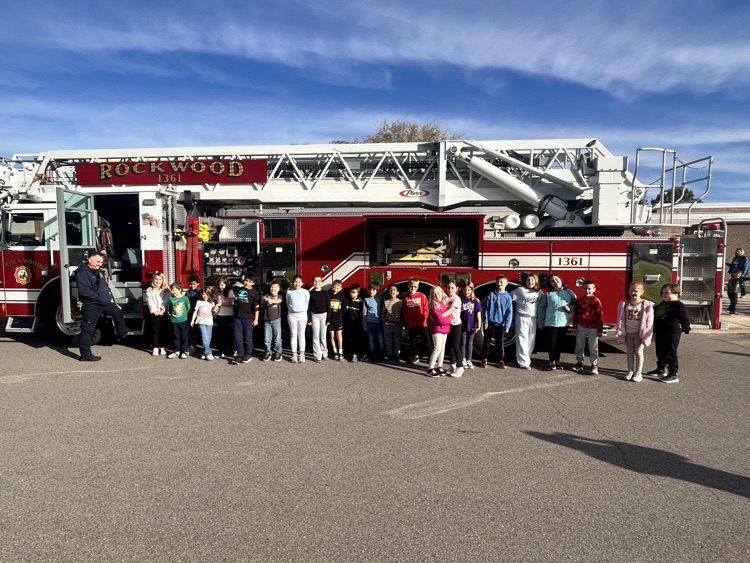 Students getting a closer look at the firefighter equipment.