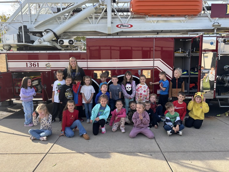 Students getting a closer look at the firefighter equipment.