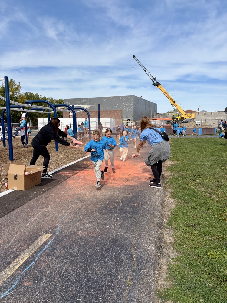 students running in a color run