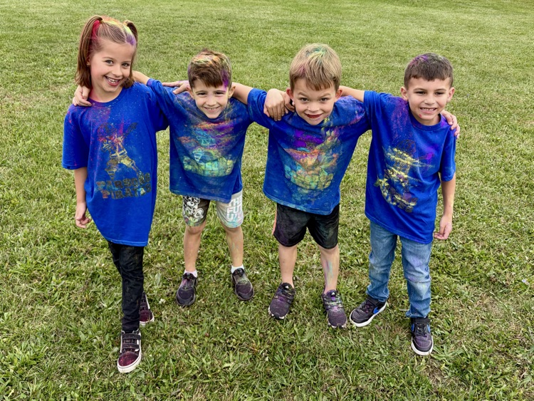 students running in a color run