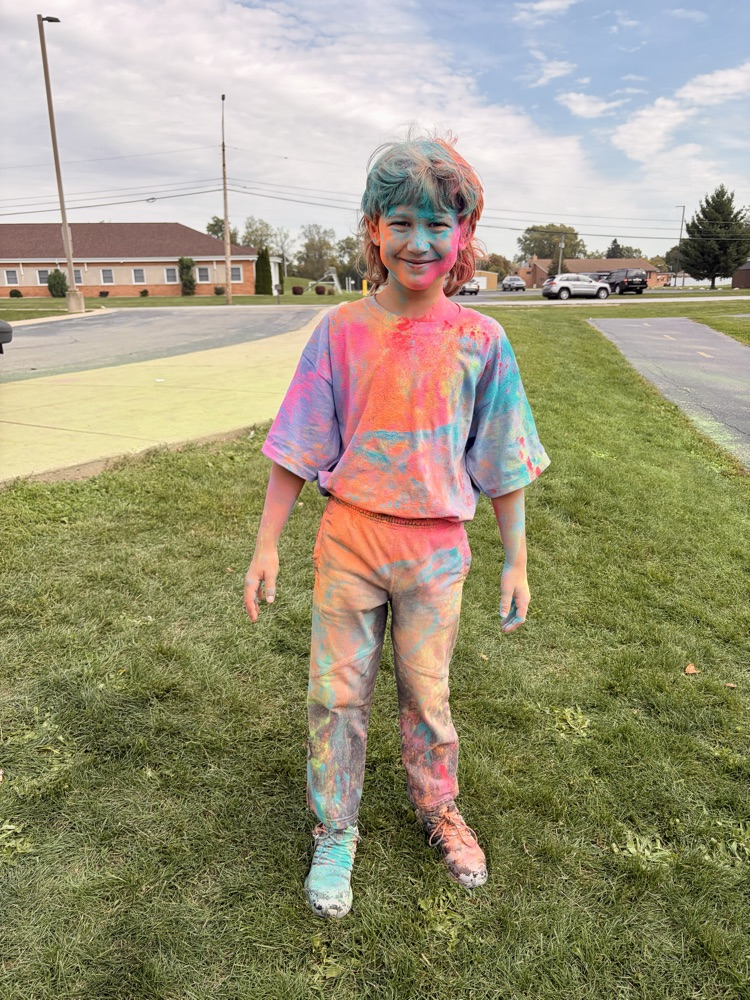 students running in a color run